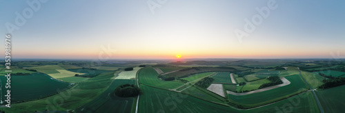 Aerial panorama view of  sunrise over the Ridgway near Swindon, Wiltshire photo
