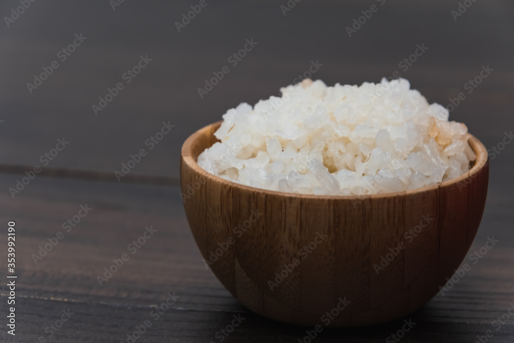 Healthy food. Wooden bowl with parboiled rice. Rice close-up Healthy food. Wooden bowl with parboiled rice. Rice close-up