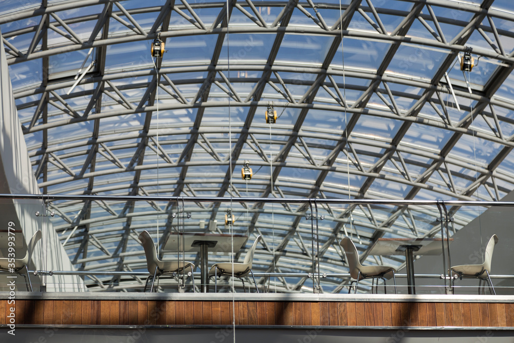 Modern cafe under the dome of glass and metal. Modern cafe under the dome of glass and metal.