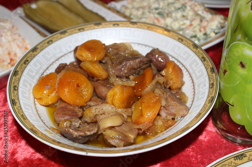 Obraz na płótnie Meat stew, turshu govurma with onions and chestnuts served on plate. w salonie