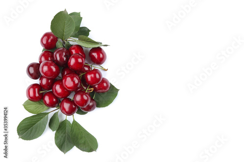 Sweet cherries with green leafs isolated on white background