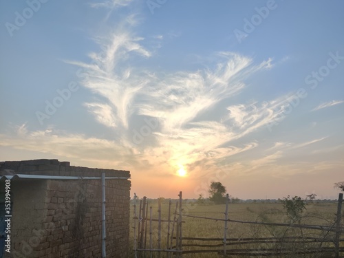 sunset in an Indian Village. Sky full of cloudes