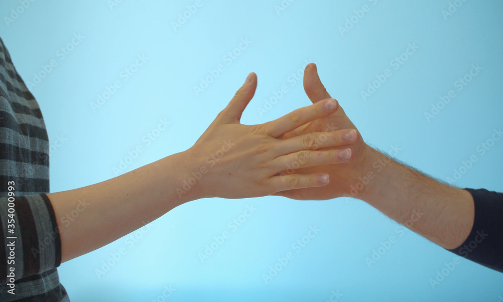 Hands of couple playing rock paper scissors Hands of couple playing rock paper scissors