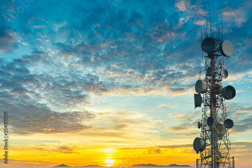 telecommunication tower at sunset sky background photo