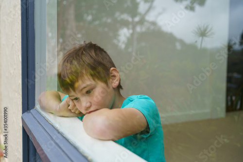 Young boy stuck at home during isolation