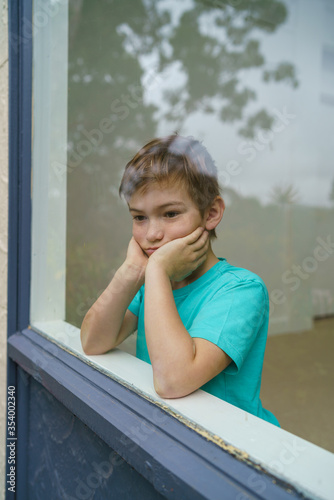 Young boy stuck at home during isolation