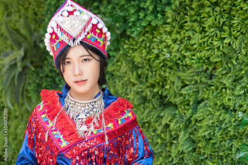 Foto portrait of Hmong young woman in tradition Hmong costume for young girl; Asian e