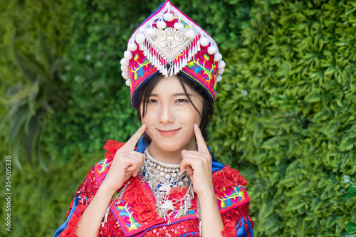 portrait of Hmong young woman in tradition Hmong costume for young girl  Asian ethnic tribal people in traditional colorful clothing culture of Hmong or Miao people in east Asia and southeast Asia