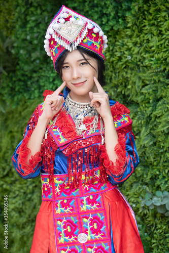 portrait of Hmong young woman in tradition Hmong costume for young girl  Asian ethnic tribal people in traditional colorful clothing culture of Hmong or Miao people in east Asia and southeast Asia