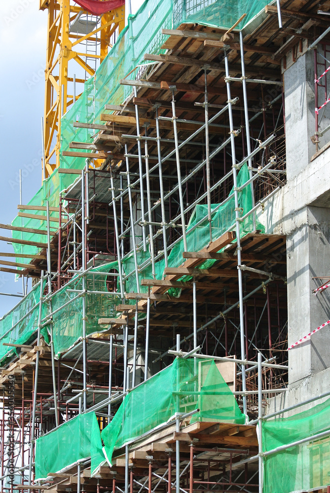 JOHOR, MALAYSIA -JUNE 30, 2016: Scaffolding used as the temporary structure to support platform, form work and structure at the construction site. Also used it as a walking platform for workers. 

