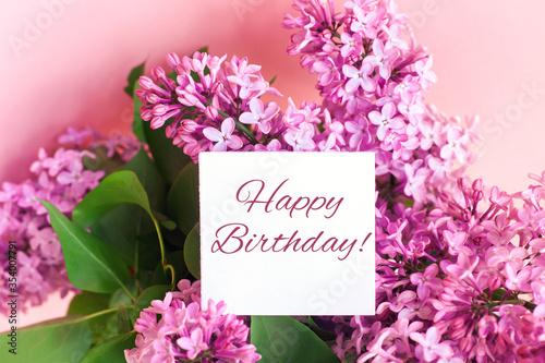 Canvas Print Happy birthday lettering and beautiful spring bouquet of lilac flowers, holiday