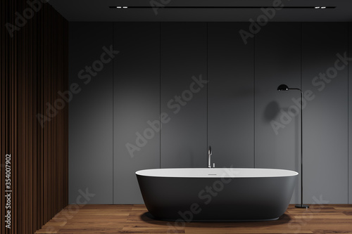 Grey and wooden bathroom interior with tub