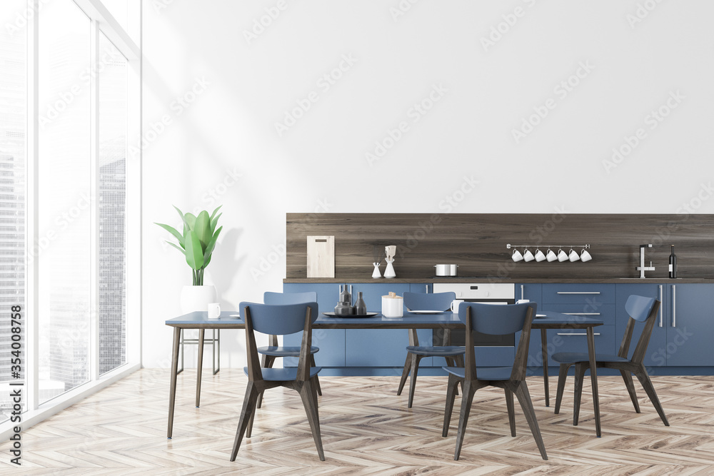 White kitchen interior, blue countertops, table