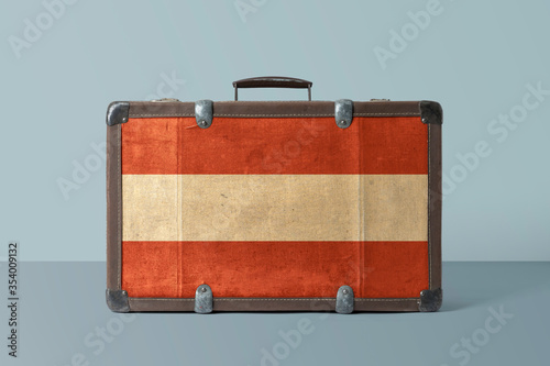 Photography Austria flag on old vintage leather suitcase with national concept
