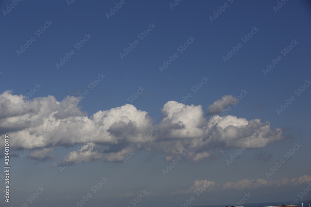 white fluffy clouds in the blue sky. white fluffy clouds in the blue sky.