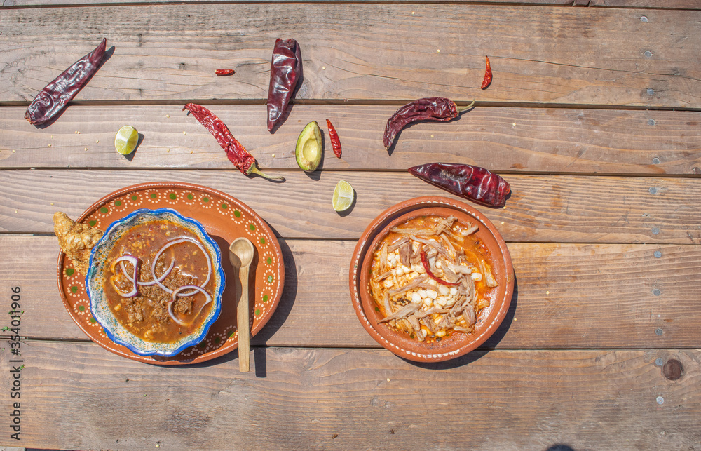 top view Mexican food, plate of birria and pozole with sauce and