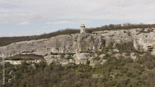 Flying drone above the cave city and monastery Shuldan, near the city of Bakhchysarai, Crimea. Aerial footage 4k