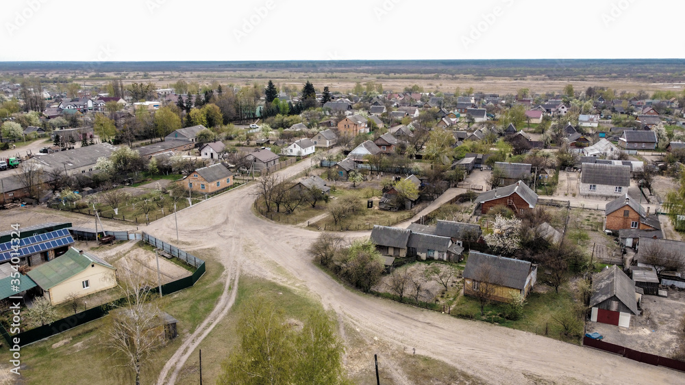 top view of village houses. Sunny spring day. Zarichne village, Polissya, Ukraine