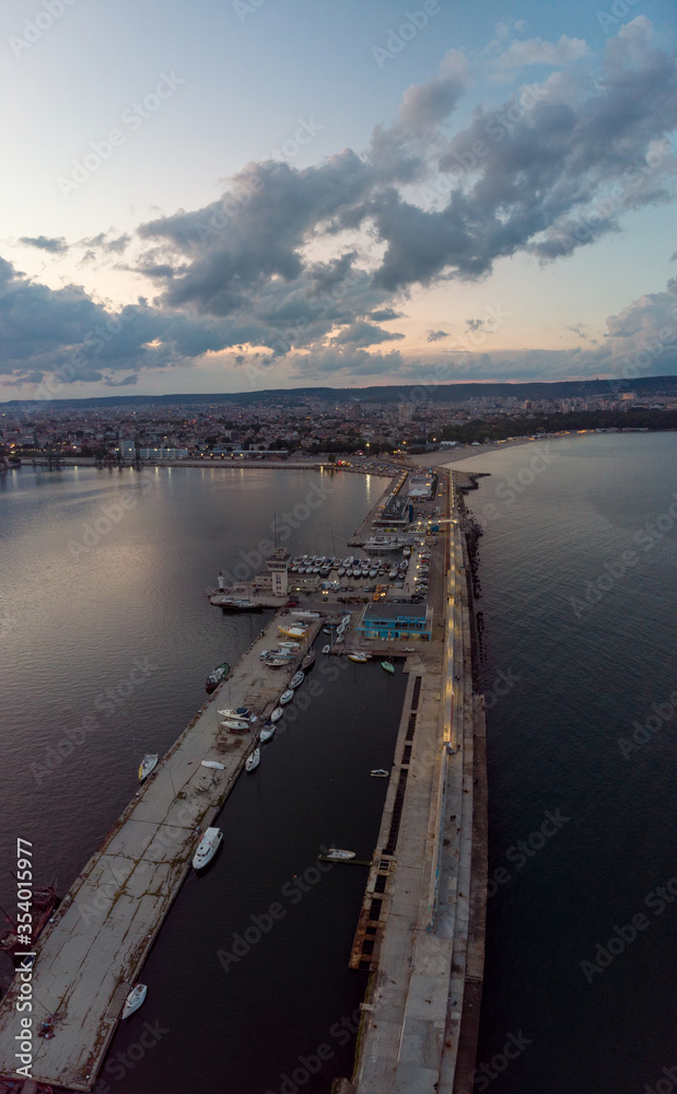 Drone Panorama of the Sea and the Varna Sea Port at sunset time with dramatic sky Drone Panorama of the Sea and the Varna Sea Port at sunset time with dramatic sky