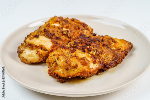 Burnt Grill Fried Chicken Breast Fillets on White Plae Isolated.