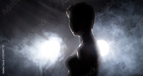 Silhouette unidentify 20s Fashion Young skinny Asian Woman shorthair beautiful cosmetic make up, wear crystal net Dress and pose difference style. Studio smoke black Background isolated copy space