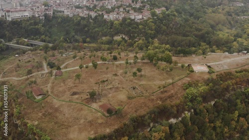 The city of Veliko Tarnovo. Top view of the famous Tsarevets fortress and mountains. Aerial footage 4k