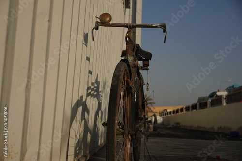 Old Bicycle with rusted rim wheel, nostalgic memories, Dubai, Uae photo