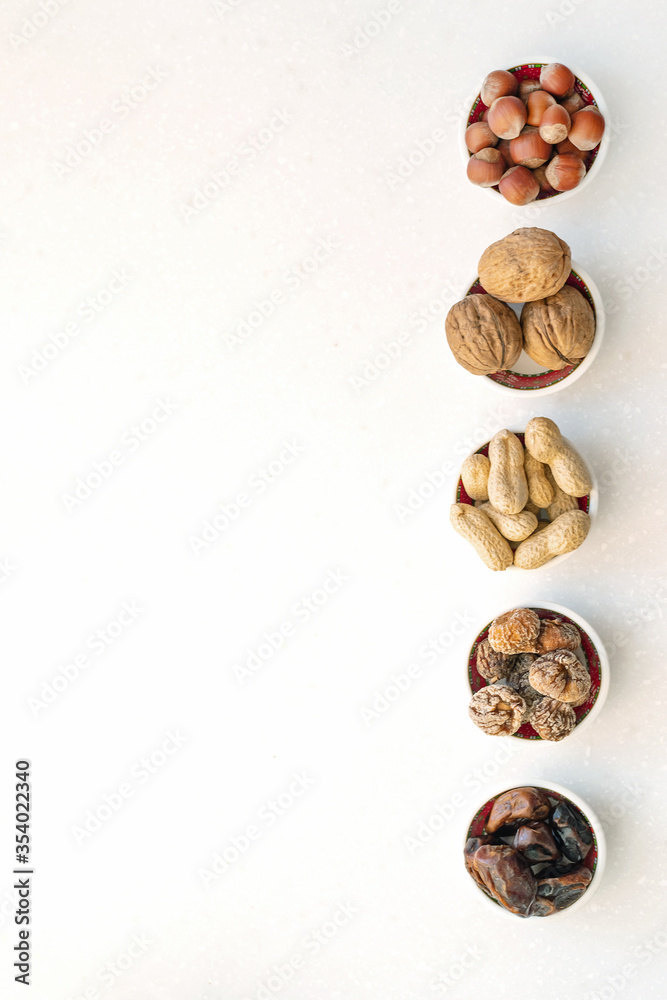 Healthy snacks nuts and dried fruits. Top view of bowls on table. Healthy snacks nuts and dried fruits. Top view of bowls on table.