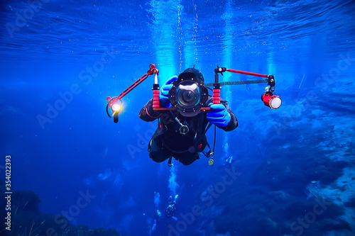 Fotografie underwater photographer with a camera, diver hobby special underwater boxing wit