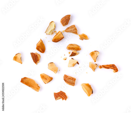 Pieces of almonds on white background