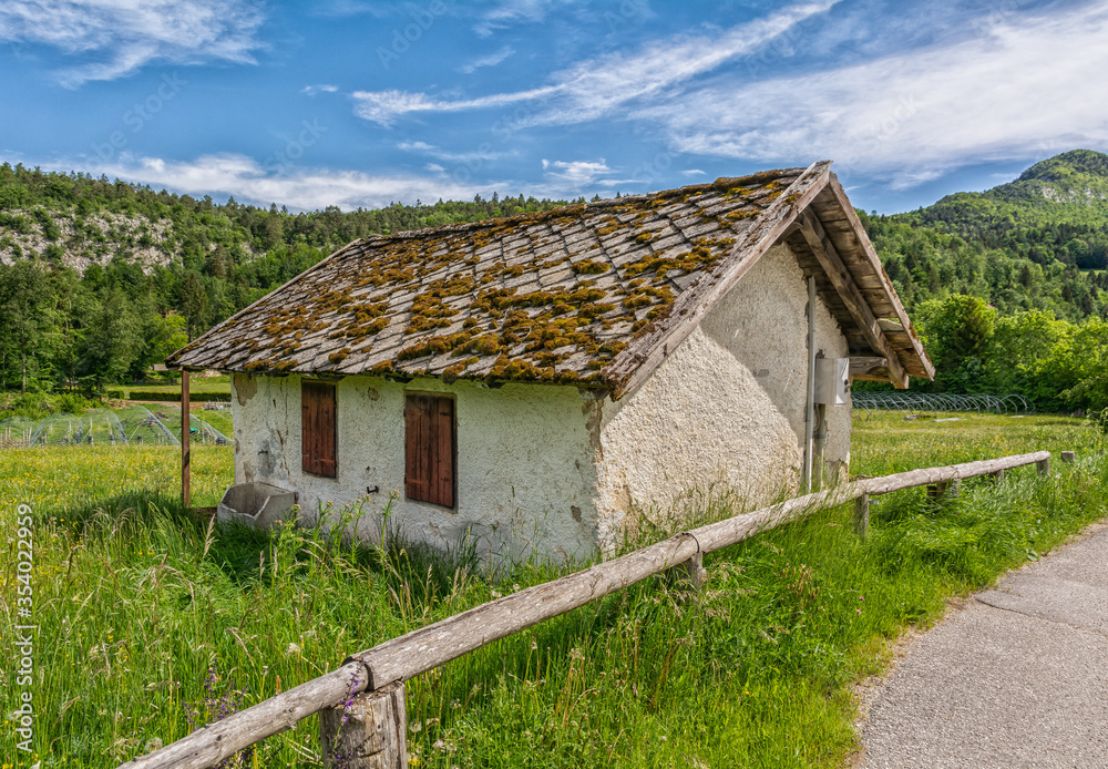 Small wooden house in a green mountain valley of Trentino Alto Adige, northern Italy, Europe. Small wooden house in a green mountain valley of Trentino Alto Adige, northern Italy, Europe.