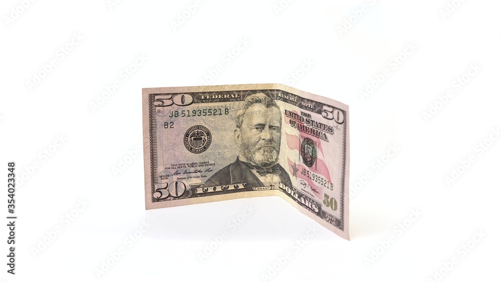 50 dollars banknote rotates on a white background. Isolate. Half-folded money side view. On the money depicted Hiram Ulysses Grant and on the other side the capitol. 50 dollars banknote rotates on a white background. Isolate. Half-folded money side view. On the money depicted Hiram Ulysses Grant and on the other side the capitol.