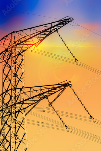 High voltage power lines. Electricity Pylons at Sunset photo