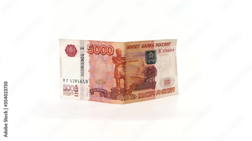 5000 rubles banknote rotates on a white background. Isolate. Half-folded money side view. The money depicts the Monument to Muravyov-Amursky with the coat of arms of Khabarovs and Bridge over the Amur 5000 rubles banknote rotates on a white background. Isolate. Half-folded money side view. The money depicts the Monument to Muravyov-Amursky with the coat of arms of Khabarovs and Bridge over the Amur
