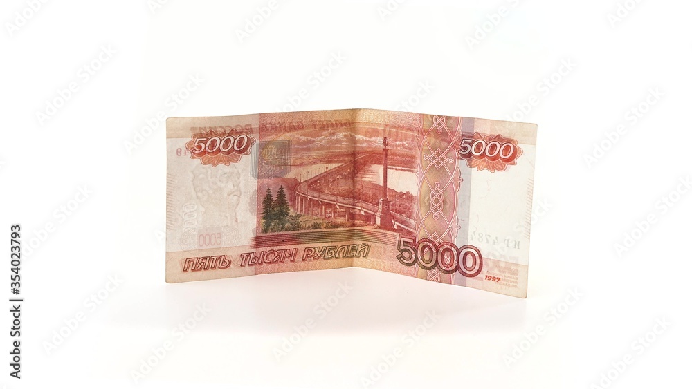5000 rubles banknote rotates on a white background. Isolate. Half-folded money side view. The money depicts the Monument to Muravyov-Amursky with the coat of arms of Khabarovs and Bridge over the Amur 5000 rubles banknote rotates on a white background. Isolate. Half-folded money side view. The money depicts the Monument to Muravyov-Amursky with the coat of arms of Khabarovs and Bridge over the Amur