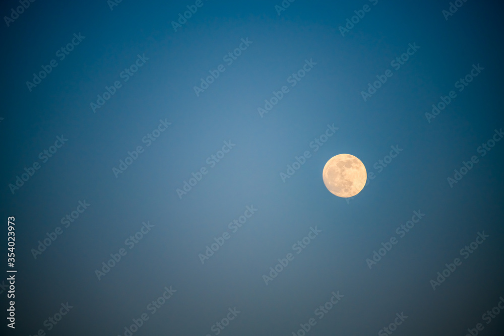 Lonely moon against a dark blue sky. Alicante province. Spain Lonely moon against a dark blue sky. Alicante province. Spain