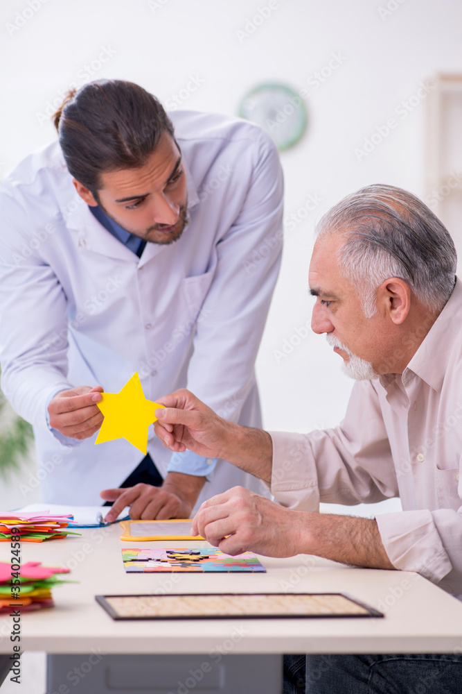 Doctor and patient suffering from Alzheimer disease Doctor and patient suffering from Alzheimer disease