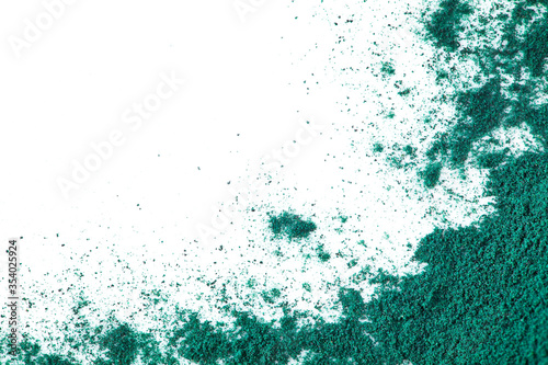 Spirulina algae powder on a white background. Superfood concept. Top view. photo