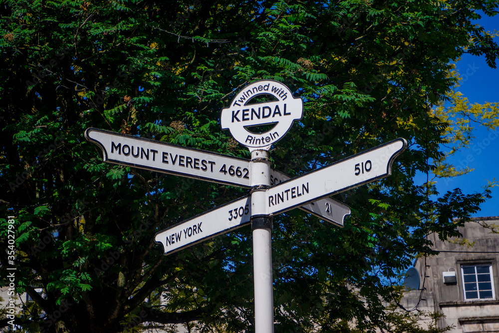 Town signpost showing directions to various places Kendal