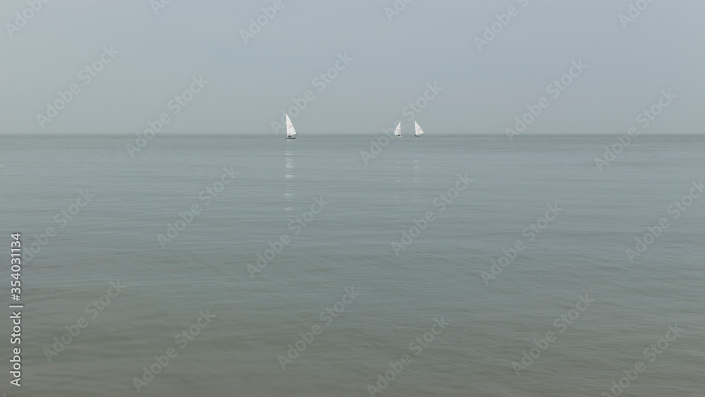 Fotografie Three sailing yachts from the Whitstable Seafront, England