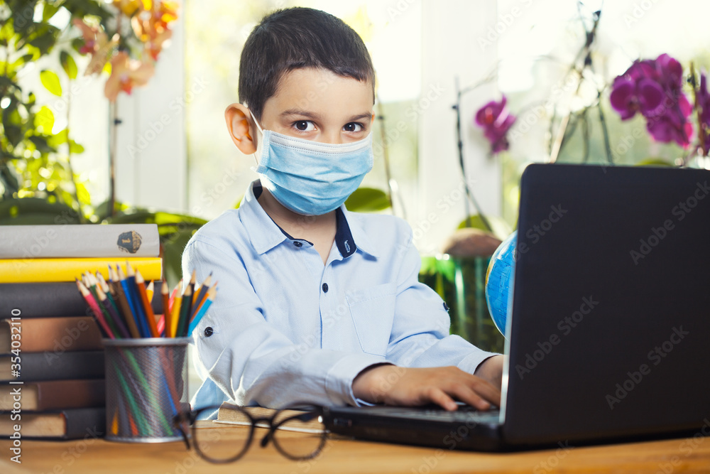 Kid self isolation using laptop for his homework,Child doing using laptop searching information on internet Kid self isolation using laptop for his homework,Child doing using laptop searching information on internet