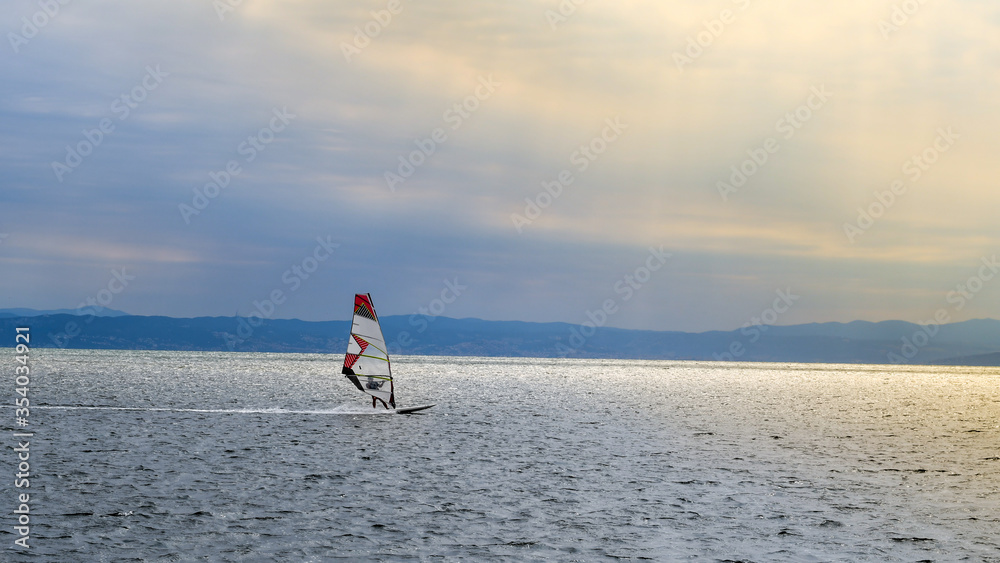 
Windsurfing in the harbor at sunset.