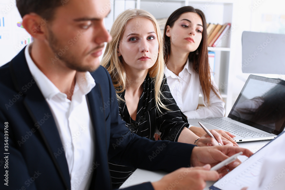 Group of people deliberate on problem Group of people deliberate on problem