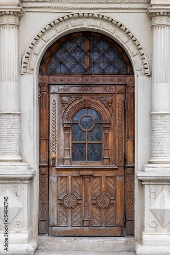 Vintage wooden door of brown color. Beautiful front door in an old city.