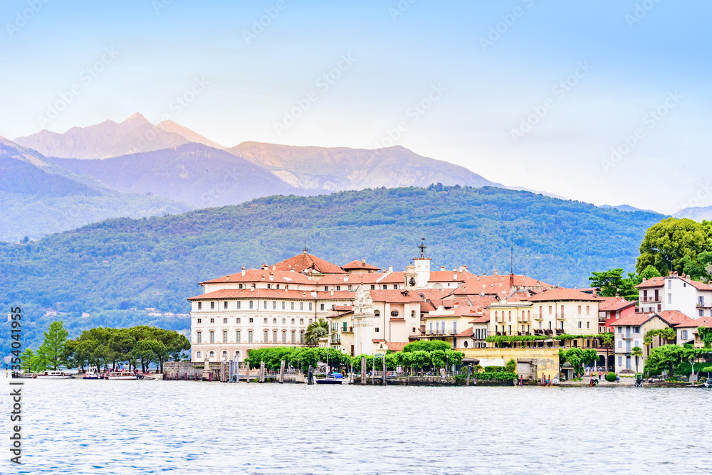 Fototapeta premium Isola Bella - fisherman island in Maggiore lake with mountains in the background, Borromean Islands (Isole Borromee), Stresa, Piedmont, Northern Italy - travel destination in Europe.
