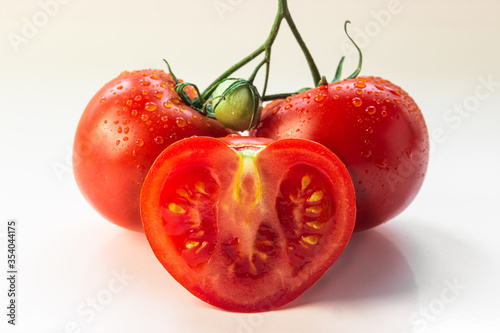set of three tomatoes close-up, sliced ​​heart-shaped tomato