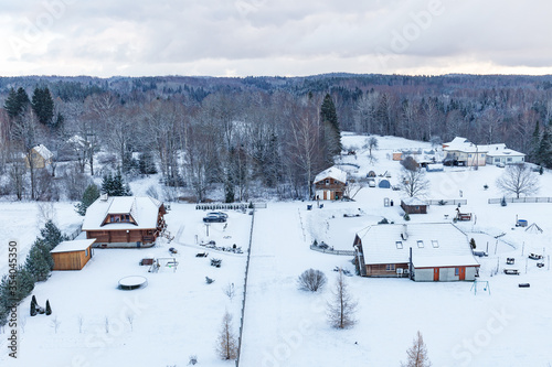 Aerial view on snowy countryside with village houses. Estonia. © yegorov_nick