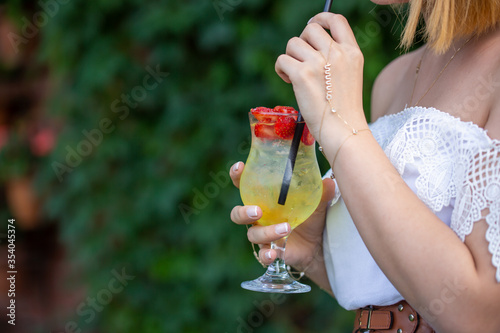 young woman with a glass of cocktail 