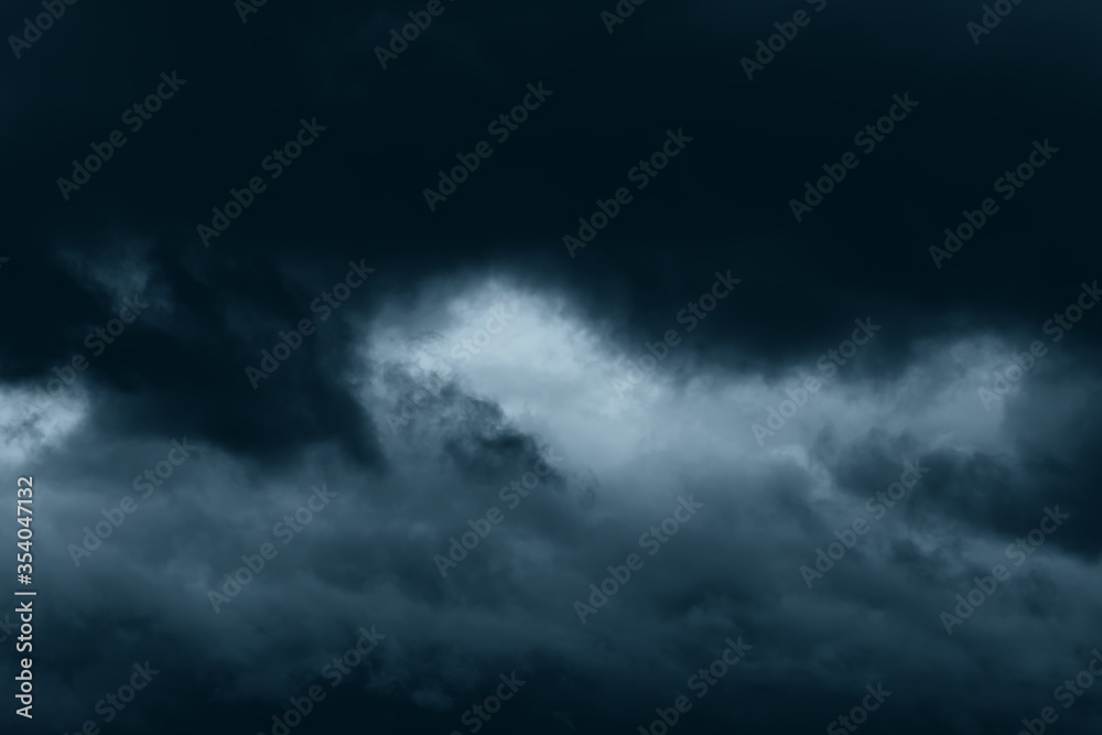 Stormy rain big fluffy clouds. Dark sky. Natural scenic abstract background. Weather changes backdrop. Sky filled with voluminous clouds. Stormy rain big fluffy clouds. Dark sky. Natural scenic abstract background. Weather changes backdrop. Sky filled with voluminous clouds.