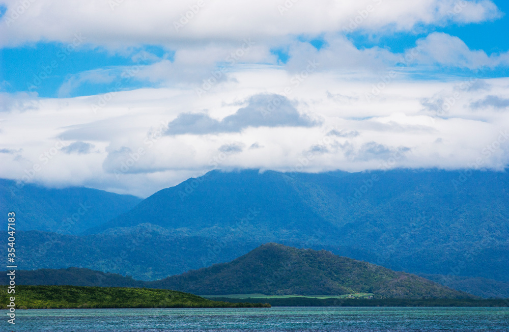 High rainforest covered mountains outside the small city of Port Douglas in Queensland, Australia